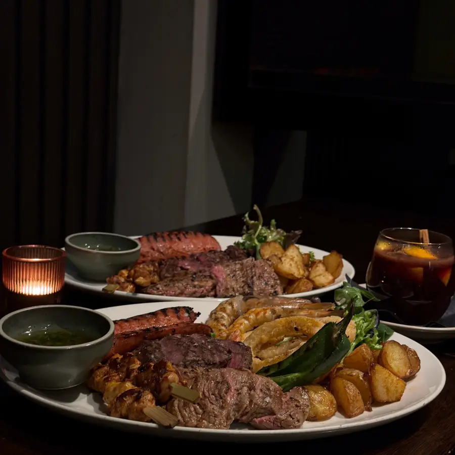 A candlelit mixed grill feast at Amigos y Familia